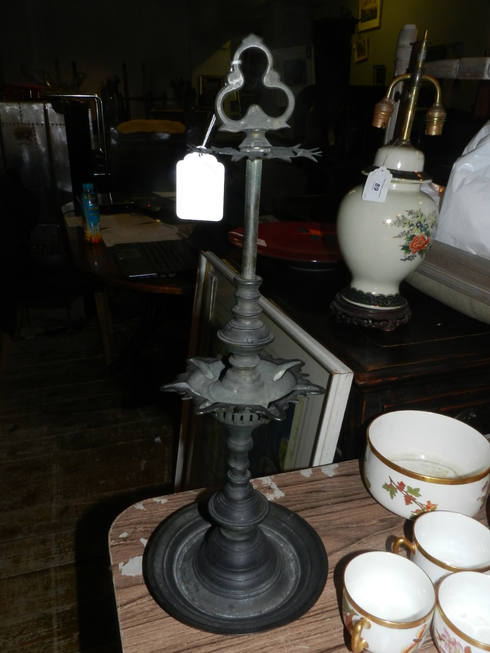 A 19th century Indian bronze oil lamp, having a turned stem. H.50cm - Image 2 of 3