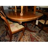 A George III style mahogany D-end extending dining table (two extra leaves), with a set of four