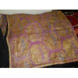 A Large Turkish silk textile, embroided with stylised flowers in gilt on a purple ground. L.180cm,