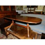 A mahogany oval coffee table, raised on splayed legs. H.47cm W.119cm