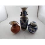 A Chinese blue and white twin handled vase, together with a Chinese blue and white ginger jar and