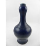 A Chinese hard paste porcelain baluster vase, overall glazed in dark blue. H.20cm
