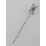 A white metal amethyst set filigree tie pin, stamped 10k.