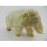 A Canton School ivory study of an elephant. L.8.5cm