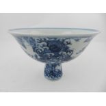 A Chinese blue and white hard paste porcelain stew bowl, decorated with stylised animals upon the