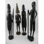 Four carved African figural studies.