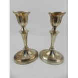 A pair of 20th century silver candlesticks, hallmarked Sheffield. H.17cm