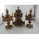 A mid 19th century French Gothic revival ormolu clock garniture, the clock of architectural form