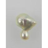 A naturally formed Baroque pearl.