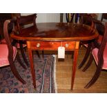 A George III mahogany and satin wood cross banded Pembroke table, fitted end drawers with opposing