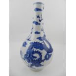 A Chinese hard paste porcelain baluster vase, decorated with dragons chasing pearl, bears six