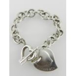 A Tiffany & Co., 925 sterling silver bracelet, having heart shaped charms.