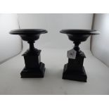 A pair of French Egyptian revival black slate tazzas, having dished tops,raised on square column