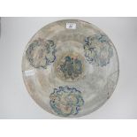 A late 19th/ early 20th century Chinese celadon pottery bowl, polychrome decorated with dragons.