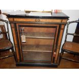 A mid Victorian walnut and ebonised pier cabinet, having a glazed door enclosing two shelves raised