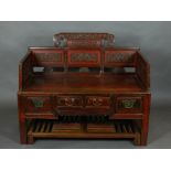 An unusual Chinese scarlet lacquered conservatory seat, fitted drawers to base, raised on moulded