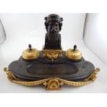 A fine French Third Empire style ormolu and pattinated bronze desk stand, centred with a Classical