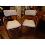 A set of four Art Deco period walnut elbow chairs.