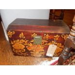 A Chinese wooden chest, having stylised floral designs. H.30cm W.44cm