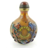 A Peking glass snuff bottle, decorated with dragons