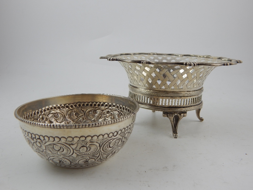 A Carrington & Co Edwardian reticulated silver bonbon dish, together with a white metal embossed