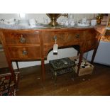 A George III mahogany bow fronted side board, box wood line inlaid, having central drawer flanked