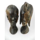 A pair of carved wooden African busts.