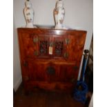 A Korean elm side cabinet having foliate pierced cupboard doors above too further cupboard doors