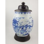 A Chinese porcelain ovoid vase, decorated with children playing in a stylised garden. H.24cm