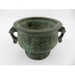 A Chinese patinated and cast bronze censor, with relief carved geometric decoration. H.9cm W.15cm