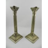 A pair of late 19th / early 20th century silver plated Corinthian column candlesticks, with