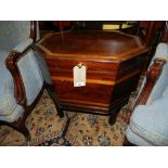 A George III mahogany cellarette, satin wood banded, raised on later frog back moulded legs. H.63cm