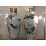 A pair of 19th century Chinese hard paste porcelain vase table lamps, having associated ormolu tops,