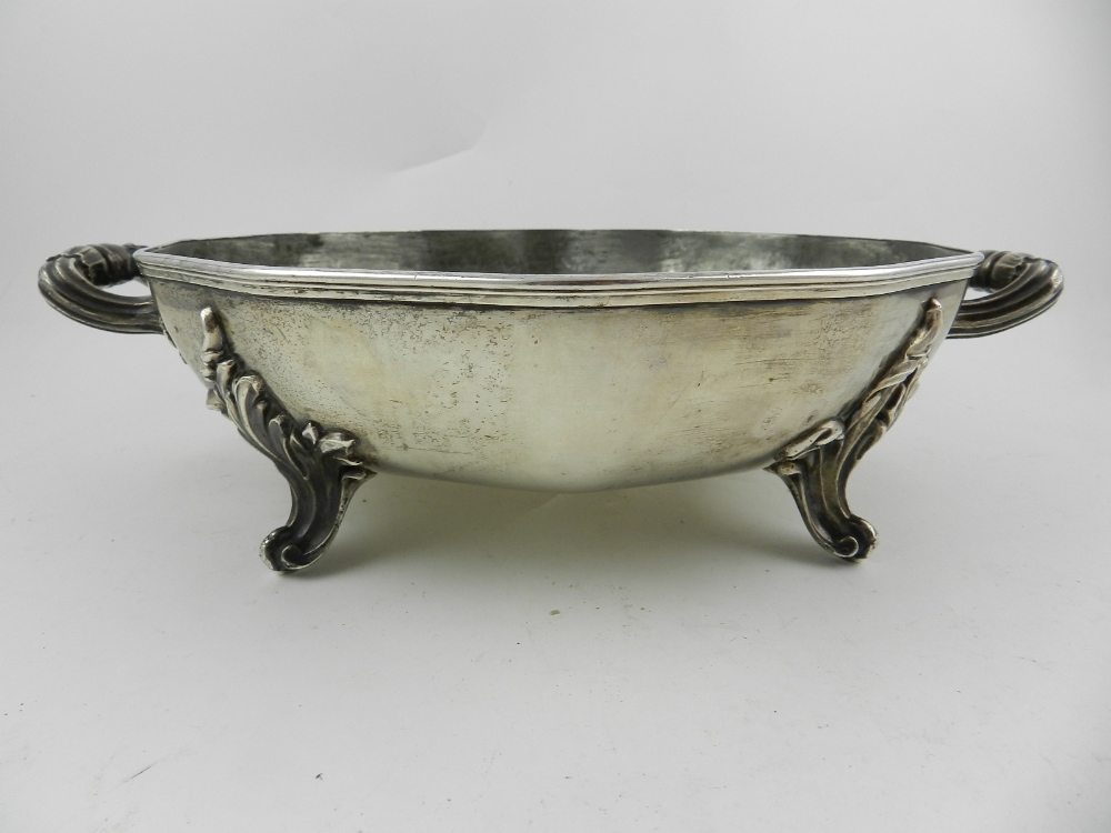 A silver and pewter twin handled chafing dish, Continental hallmark to base, raised on four feet.