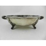 A silver and pewter twin handled chafing dish, Continental hallmark to base, raised on four feet.