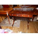 A late George III mahogany sofa table, ebony lined inlaid, fitted two frieze drawers with two bow