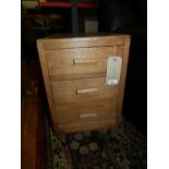 A pair of Art Deco oak bedside chests.