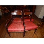 A set of eight George IV mahogany dining chairs, with reeded tablet rails and foliate carved spars