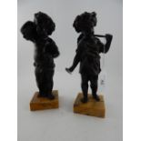 A pair of mid 19th century French patinated bronze allegorical figural studies of young children,