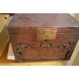 A Chinese wooden box, carved with birds and foliage to front, with fitted interior. H.26cm L.35cm