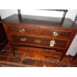 Shapland & Petter, Barnstable. An Edwardian mahogany satin wood cross banded dressing chest, having