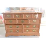 A jewelllery box in the form of a chest of drawers, w. 38cm.