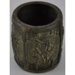 A Chinese style circular aged metal brush pot cast with panels of peoney and bamboo, H. 10cm.