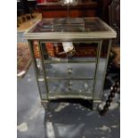 A pair of Venetian style mirrored three drawer bedside chests on square tapered feet.
