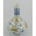 A blue and white baluster shaped vase, decorated with kilin in flight, gilt highlights,