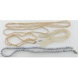 A grey baroque pearl necklace, L. 50cm, together with a four seed pearl necklaces, (5).