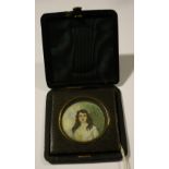 A circular painted portrait on Ivory in folding leatherette travel case