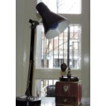 A vintage Peugeot tinplate and bakelite coffee grinder and an angelpoise lamp.