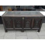 A 19th Century carved oak coffer,