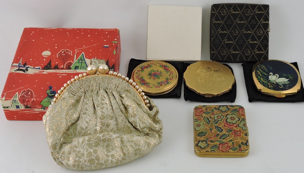 A ladies loose powder compact by Stratton, the cover engraved with a rose, with box,